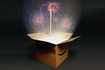 Photo-illustration of an Amazon box, open, with fireworks coming out of it