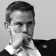 Adam Kinzinger in black and white