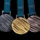 Three Pyeongchang 2018 Olympic medals on a black background