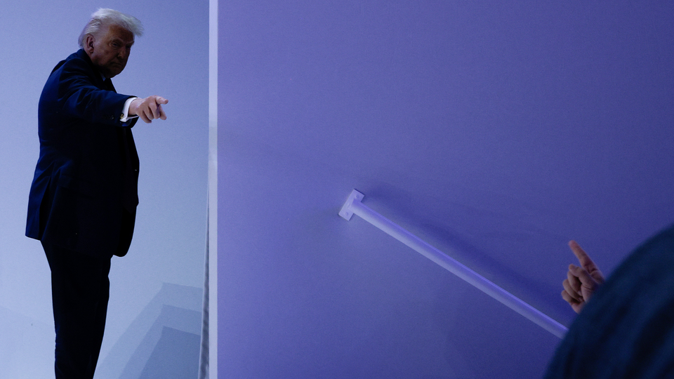 President Donald Trump points -- and a finger points back