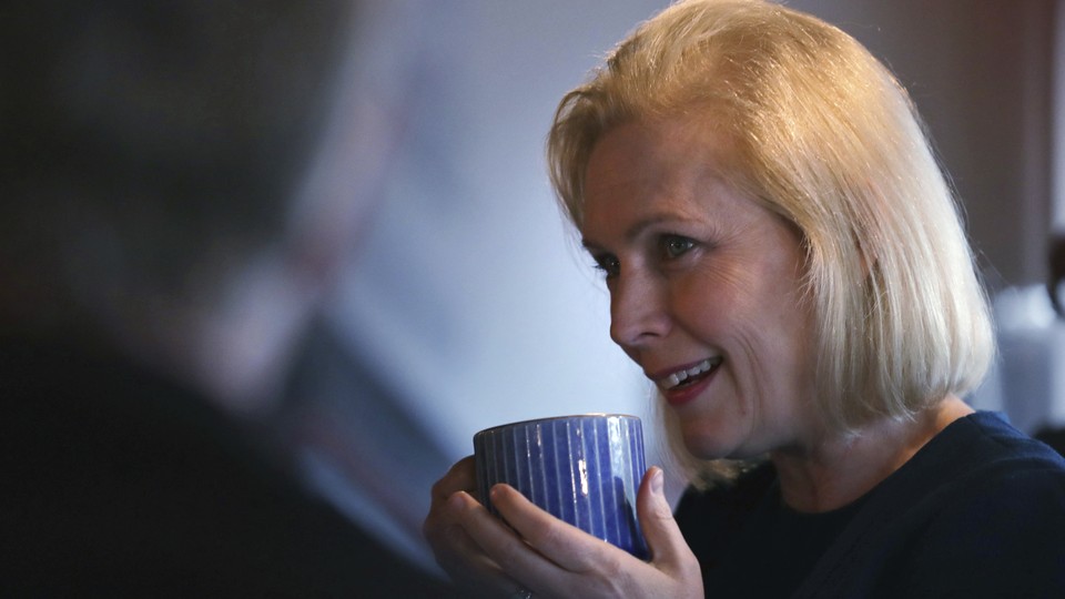 Senator Kirsten Gillibrand holding a cup of coffee