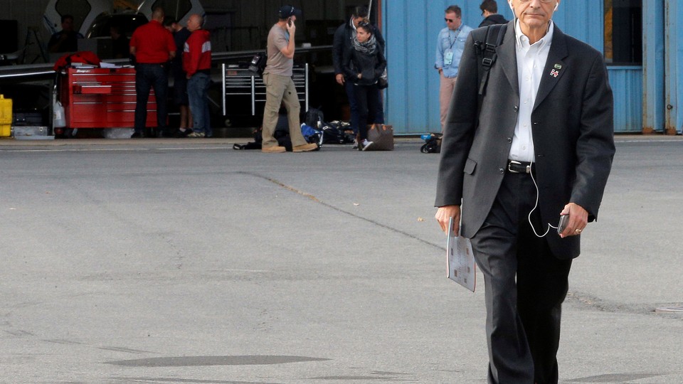 John Podesta, Hillary Clinton's campaign chairman, boards an airplane in White Plains, New York