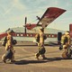 Smoke jumpers in gear boarding a plane