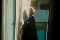 A photo of a woman with face obscured