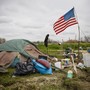 A tent city with an American flag raised
