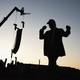 The silhouette of President Trump leaving the stage after speaking at the Iowa State fairgrounds in Des Moines, Iowa on July 3, 2025