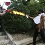 Corey Long sprays a makeshift flamethrower at white nationalist demonstrators