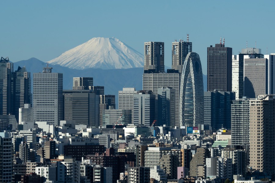 Part of the skyline of Tokyo, Japan, with Mount Fuji in the distance
