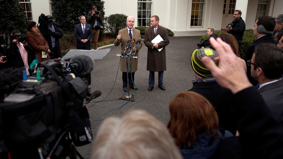 Secretary of Health and Human Services Tom Price and Mick Mulvaney, director of the Office of Management and Budget, speak to reporters outside the White House on Monday.