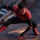 Tom Holland posing on a building as Spider-Man in 'Spider-Man: No Way Home'