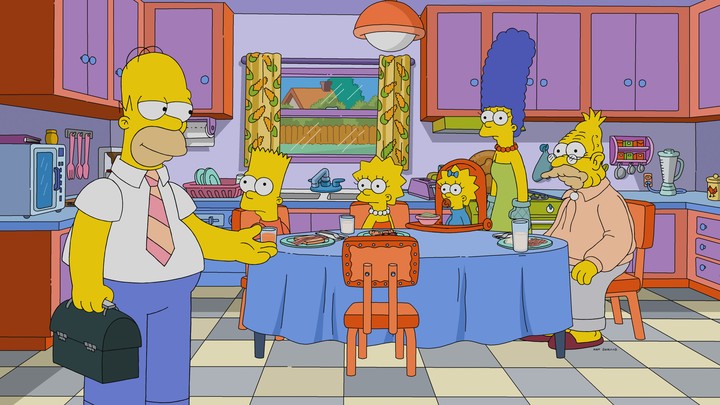 The Simpsons family sits around the breakfast table