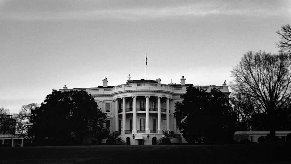 A black-and-white photo of the White House