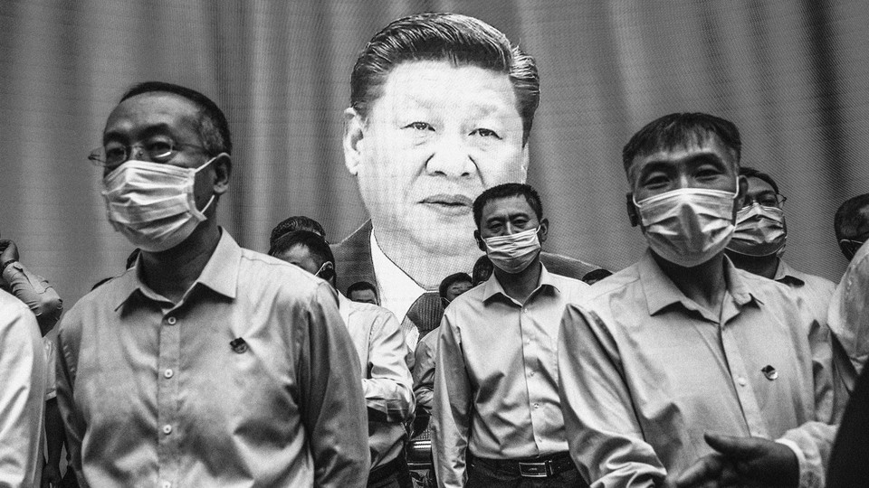 Xi Jinping giving a speech on a screen behind a row of masked people