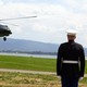 A US Marine honor guardsman stands at attention as Marine One lands with US President George W. Bush