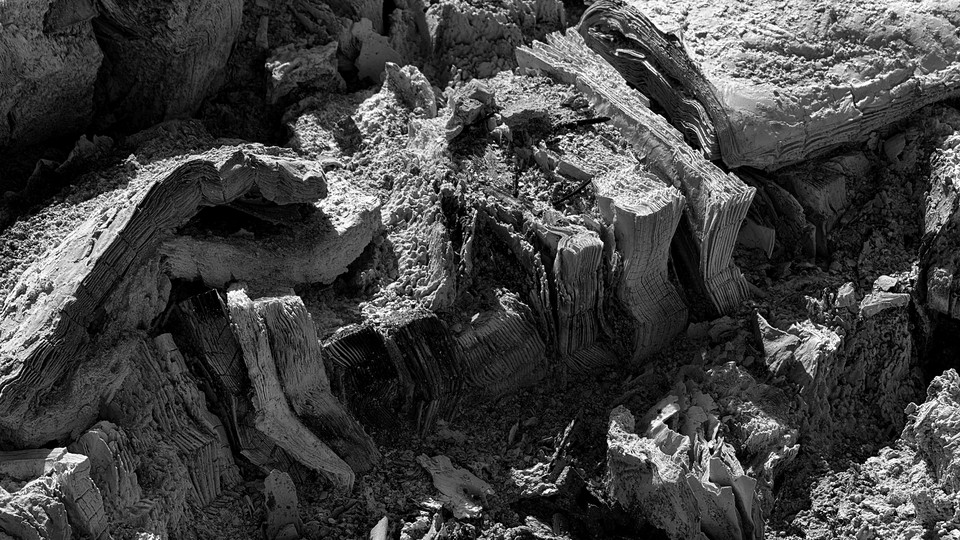 A black-and-white photo of burned books
