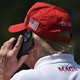 The back of Donald Trump's head, with a red MAGA cap