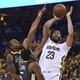 The New Orleans Pelicans forward Anthony Davis (23) shoots the basketball against Golden State Warriors forward Andre Iguodala (9) and forward Kevon Looney (5) in a May 1 game