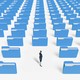 person looking back at rows and rows of file folders