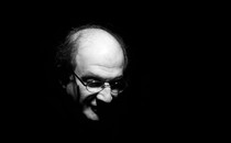 A black-and-white portrait of Salman Rushdie