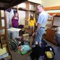 Parents help their daughter, a freshman, move into her dorm at the University of Iowa.