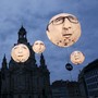 Balloons made by the 'ONE' campaigning organisation depicting leaders of the countries members of the G7 are seen in front of the Frauenkirche cathedral in 2015.
