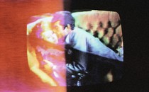 A man and a woman embrace.