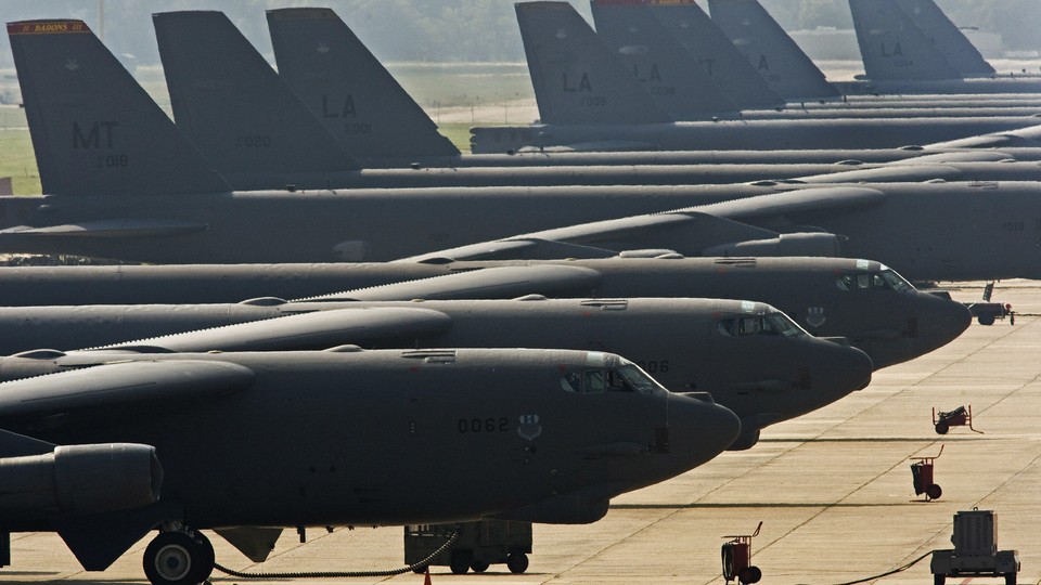 An image of US Air Force B-52H long range strategic bombers sitting on a tarmac.
