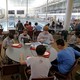 Students eat lunch in a cafeteria 
