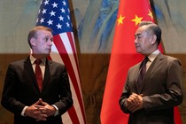 A photo showing U.S. National Security Adviser Jake Sullivan and Chinese Foreign Minister Wang Yi looking at each other.
