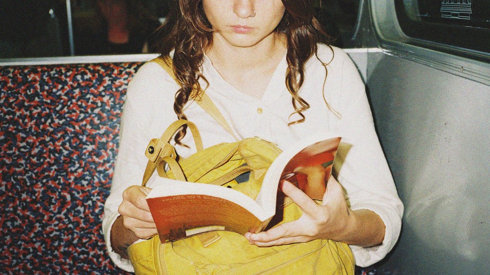A photo of a woman reading