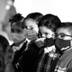 A row of children in face masks
