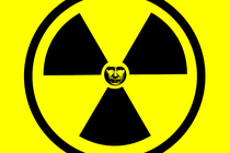 An illustration of a Ionizing radiation symbol with a black-and-white photo of Vladimir Putin in the center.