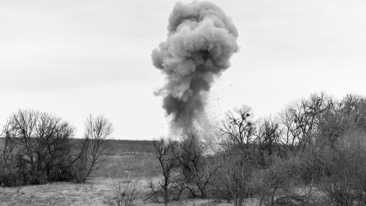 Cloud of dust and debris from an explosive
