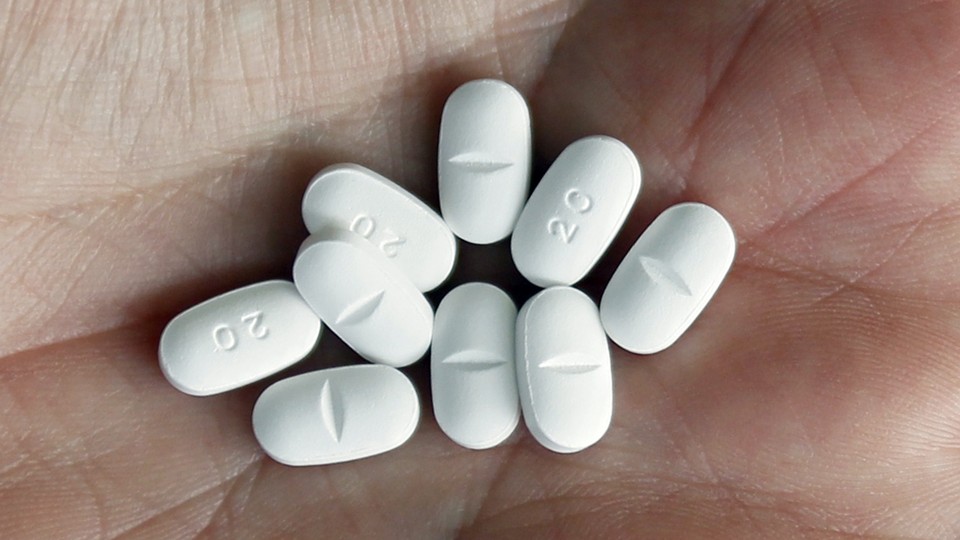White pills resting in a palm 
