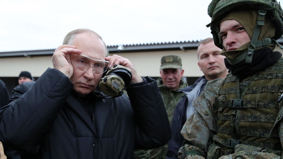 Vladimir Putin meeting Russian soldiers during an October 20 visit.