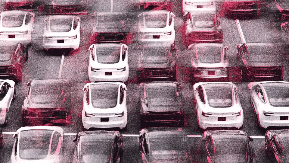 An image of Teslas in a parking lot