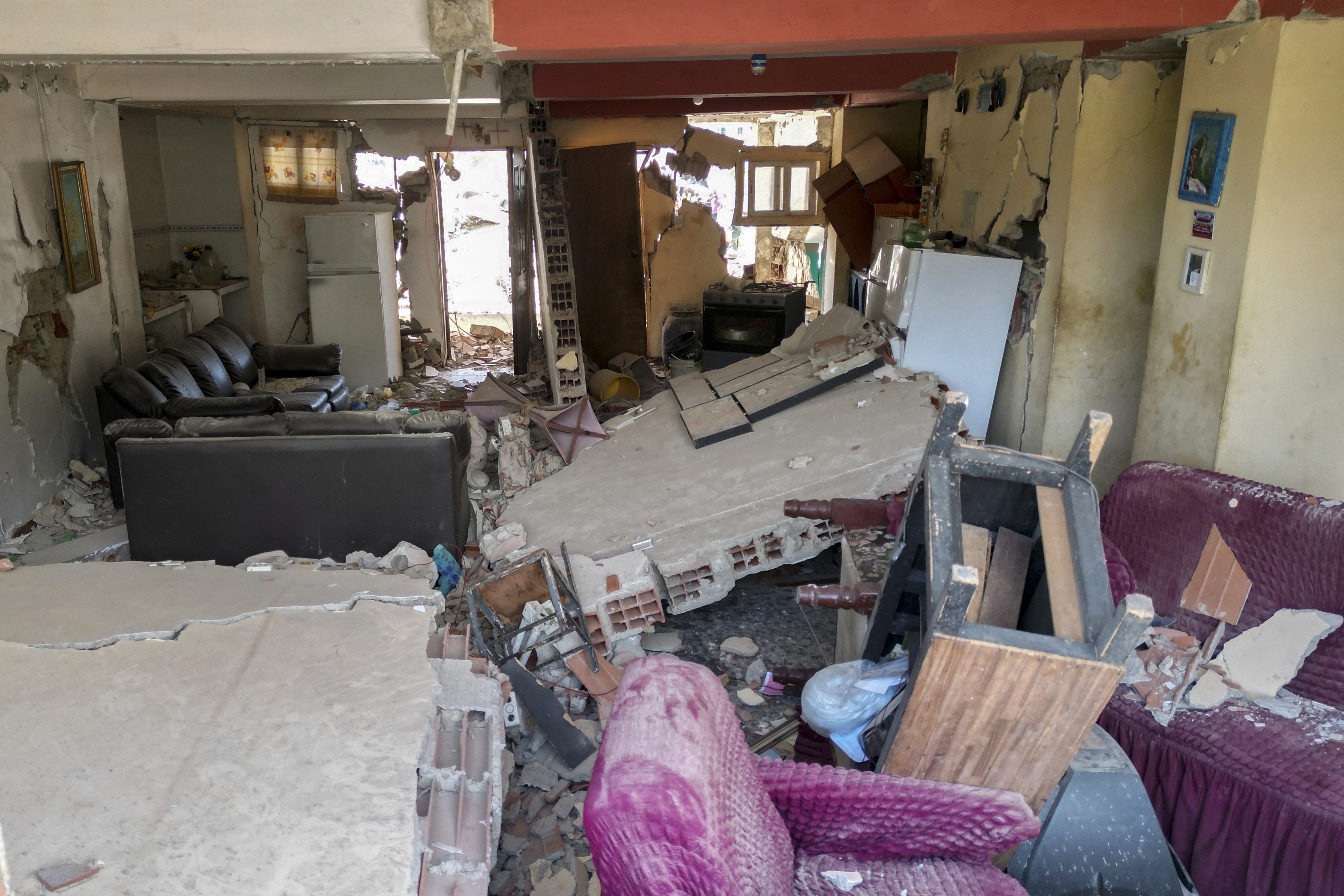 A view of the interior of an apartment in a partially-collapsed building