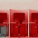 An image of office desks with a red hue