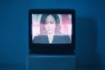 illustration of a television showing an attack-ad image of Kamala Harris