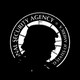 The badge of the National Security Agency with a silhouette of Donald Trump’s head in front of it