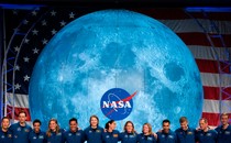 American and Canadian astronauts, who will someday be eligible to train for future moon missions, pose for a picture