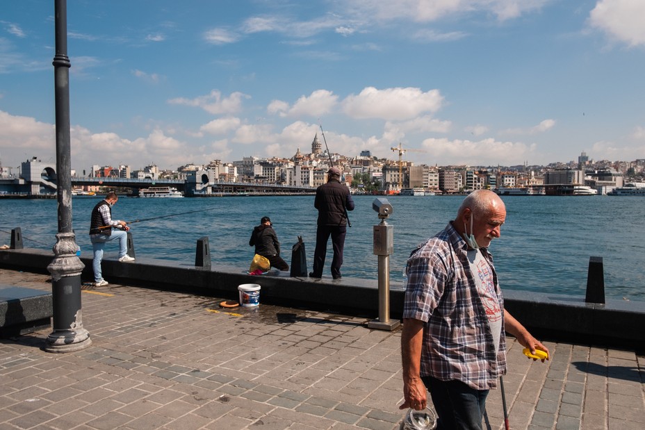Eminonu, Istanbul, Turkey. Fishermen head to the coastline of the Borphorus after a 17 day nationwide lockdown was lifted on the 17th of May 2021.