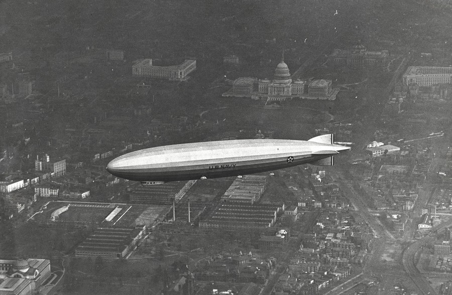 An aerial view of a rigid airship flying above Washington, D.C.