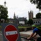 A cyclist heads past the houses of Parliament in central London.