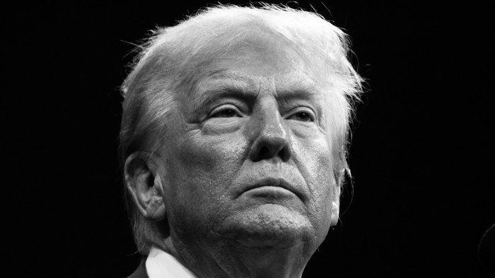 A black and white photo of Donald Trump