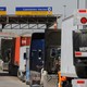 Trucks wait in a long queue for border customs control to cross into the U.S. at the Otay border crossing in Tijuana, Mexico.