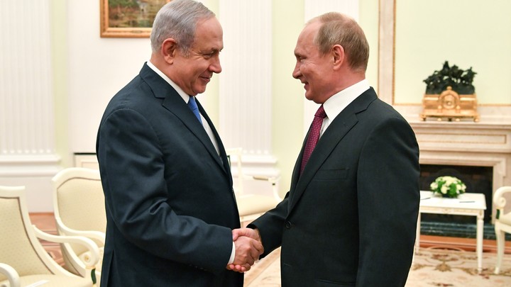 Netanyahu and Putin shake hands at a meeting at the Kremlin in July.