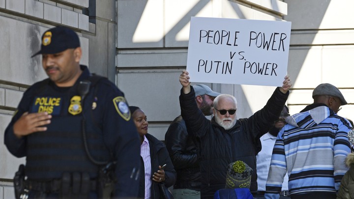 A protester outside a federal courthouse in Washington where Michael Flynn appeared with his lawyers