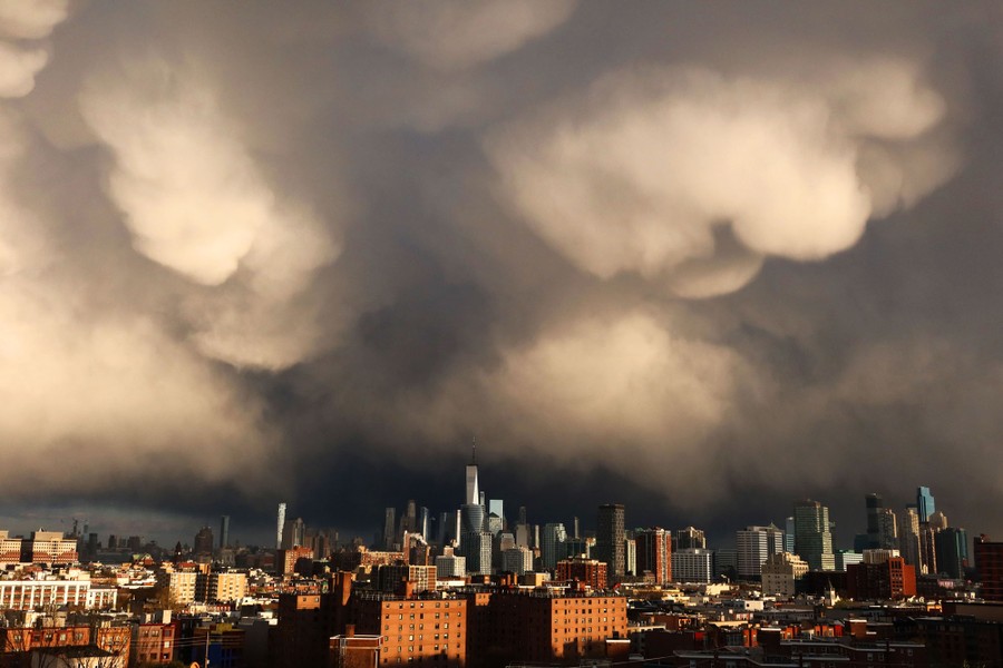 Storm clouds gather above New York City.