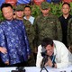 Philippine president Rodrigo Duterte checks the scope of a rifle at a ceremony marking the turnover of free Chinese military assistance to the Philippines at Clark Air Base in June 2017.